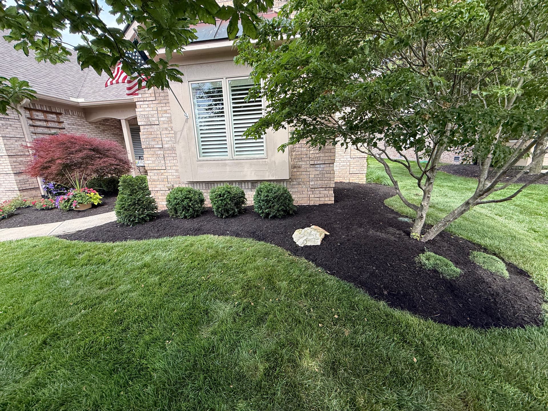 Gallery photos for Black Mulch and Clean Beds Make a Big Difference in Noblesville: Image #1