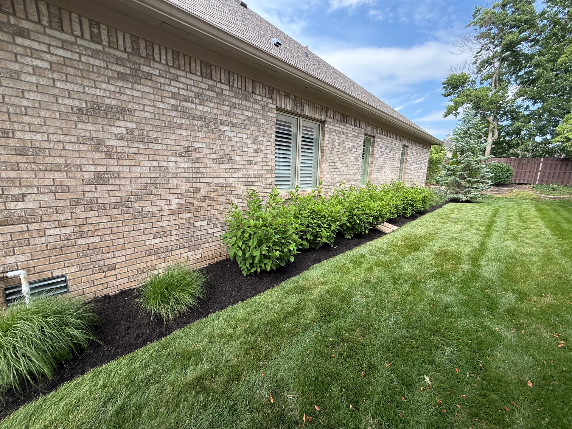 Gallery photos for Black Mulch and Clean Beds Make a Big Difference in Noblesville: Image #2