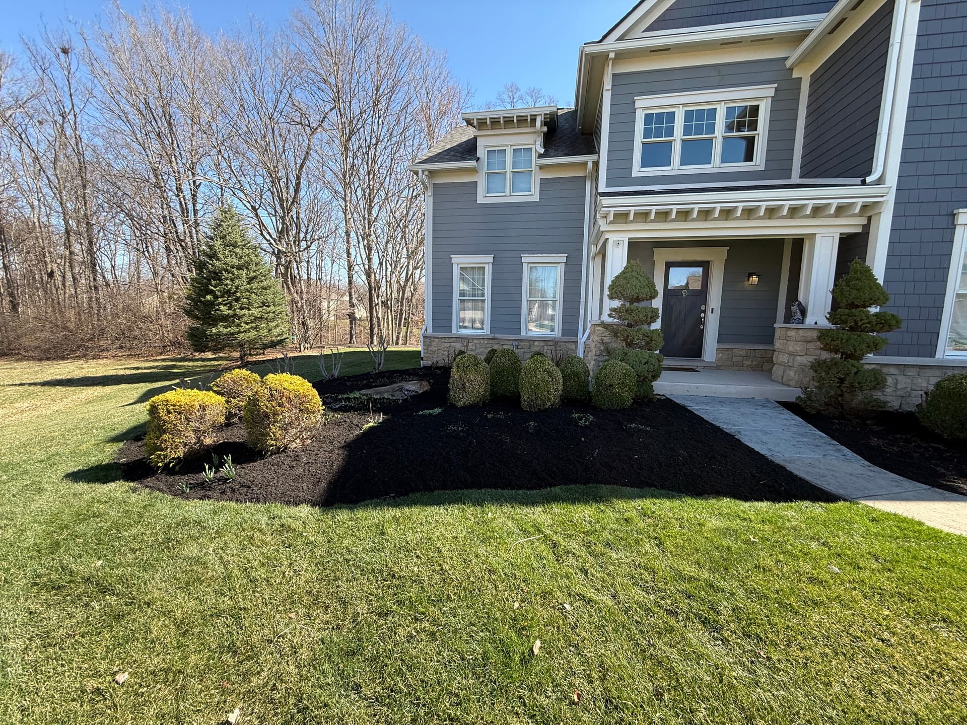 Inviting Spring with Fresh Mulch and Trimmed Shrubs in Fishers image
